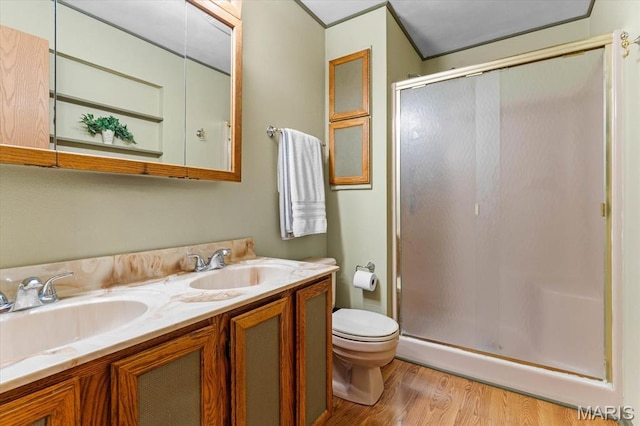 334 Hazel Ave, Belleville, IL 62223 - bathroom with a shower stall, double vanity, and wood finished floors