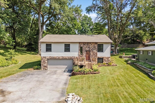 334 Hazel Ave, Belleville, IL 62223 - bi-level home featuring stone siding, asphalt driveway, a garage, and a front lawn