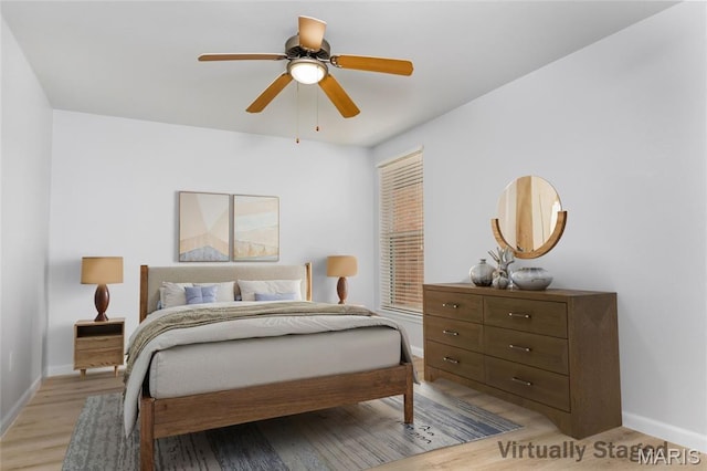 1924 Greenglen Dr Unit 102, Kirkwood, MO 63122 - bedroom featuring light wood finished floors and a ceiling fan