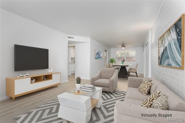 1924 Greenglen Dr Unit 102, Kirkwood, MO 63122 - living room featuring light wood finished floors and ceiling fan
