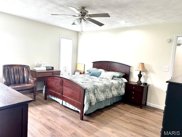 256 Black Oak Trl, Jackson, MO 63755 - bedroom featuring light wood-style floors and ceiling fan