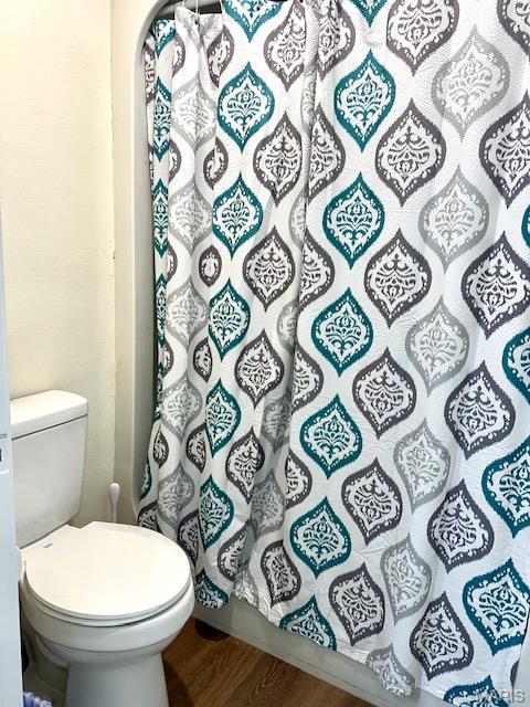 256 Black Oak Trl, Jackson, MO 63755 - full bath featuring wood finished floors and a shower with shower curtain