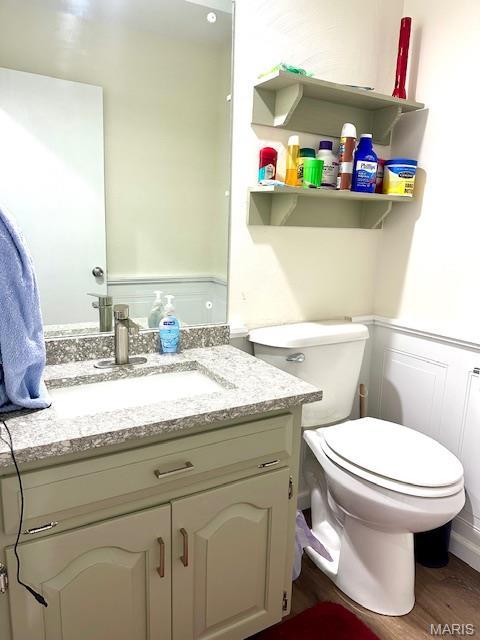256 Black Oak Trl, Jackson, MO 63755 - half bath featuring vanity and wood finished floors