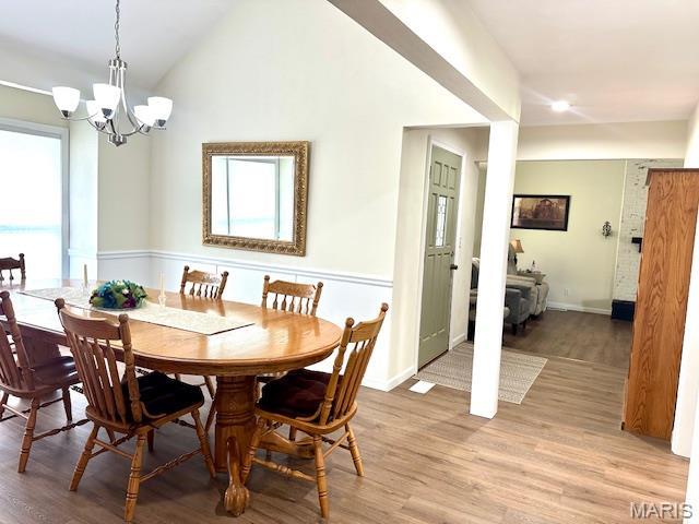 256 Black Oak Trl, Jackson, MO 63755 - dining area featuring a chandelier, light wood-type flooring, vaulted ceiling, and recessed lighting
