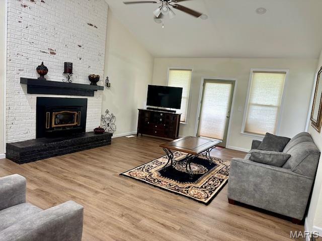 256 Black Oak Trl, Jackson, MO 63755 - living room with a ceiling fan, wood finished floors, high vaulted ceiling, and a brick fireplace