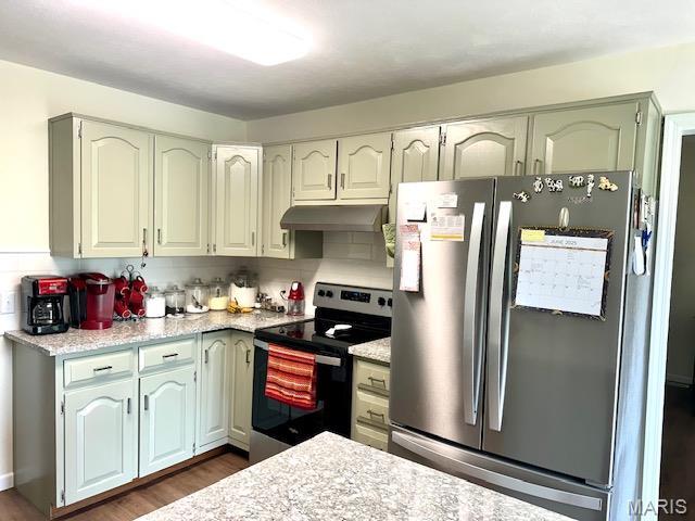 256 Black Oak Trl, Jackson, MO 63755 - kitchen with stainless steel appliances, under cabinet range hood, and dark wood-type flooring