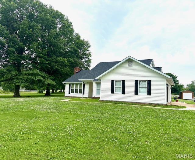 256 Black Oak Trl, Jackson, MO 63755 - view of front facade featuring a front lawn and a chimney