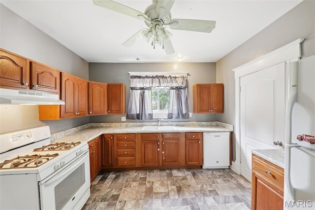 410 W Easton St, Gillespie, IL 62033 - kitchen featuring white appliances, under cabinet range hood, light countertops, and brown cabinetry