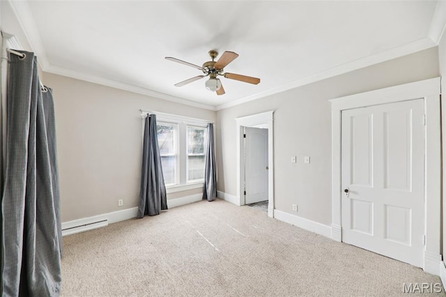 410 W Easton St, Gillespie, IL 62033 - unfurnished bedroom featuring carpet flooring, ornamental molding, a baseboard heating unit, and a ceiling fan
