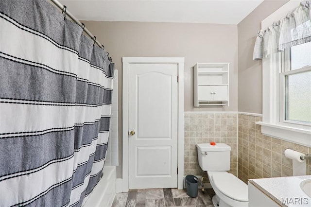 410 W Easton St, Gillespie, IL 62033 - full bath with tile walls, vanity, shower / tub combo with curtain, and wainscoting