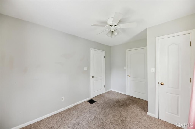 410 W Easton St, Gillespie, IL 62033 - unfurnished bedroom featuring carpet and ceiling fan