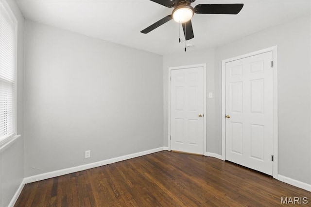 209 Monica Dr, Saint Louis, MO 63127 - unfurnished bedroom with dark wood-style floors and a ceiling fan