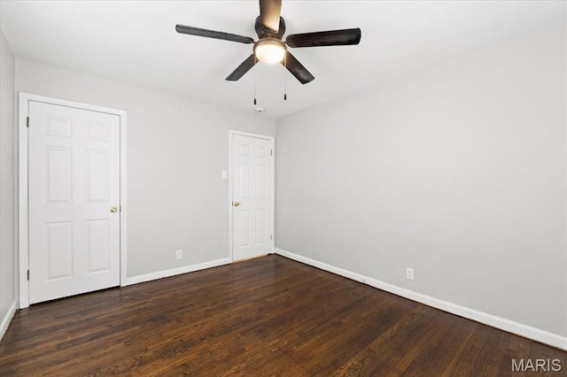 209 Monica Dr, Saint Louis, MO 63127 - unfurnished bedroom featuring dark wood-type flooring and a ceiling fan