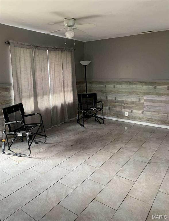 408 4th St, Doniphan, MO 63935 - living area with a ceiling fan and tile patterned floors