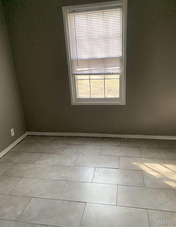 408 4th St, Doniphan, MO 63935 - spare room featuring baseboards
