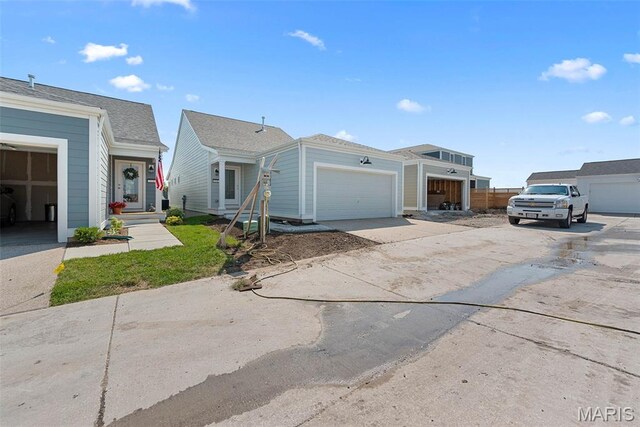 114 Marais Temps Clair, Saint Charles, MO 63301 - view of front of house featuring concrete driveway and an attached garage