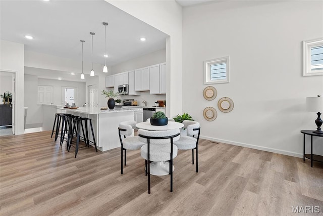 114 Marais Temps Clair, Saint Charles, MO 63301 - dining space with light wood-style flooring and recessed lighting