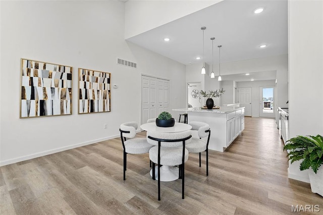 114 Marais Temps Clair, Saint Charles, MO 63301 - dining space with light wood finished floors, recessed lighting, and a towering ceiling
