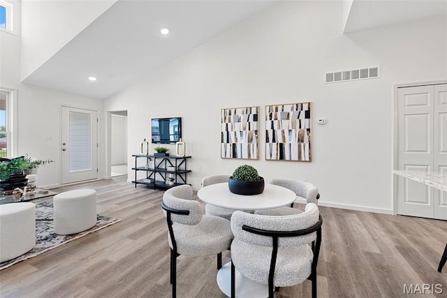 114 Marais Temps Clair, Saint Charles, MO 63301 - dining room with high vaulted ceiling, wood finished floors, and recessed lighting