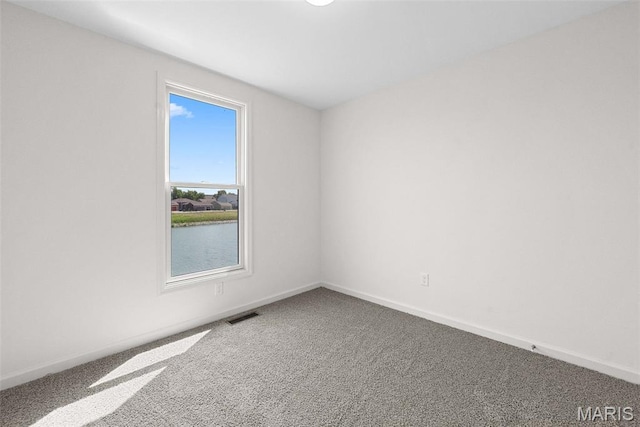 114 Marais Temps Clair, Saint Charles, MO 63301 - spare room with carpet floors and a water view