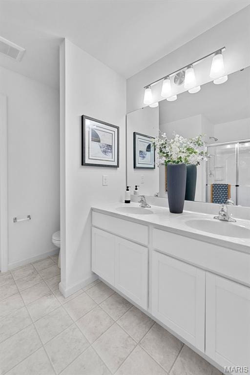 114 Marais Temps Clair, Saint Charles, MO 63301 - bathroom featuring double vanity, a stall shower, and tile patterned flooring