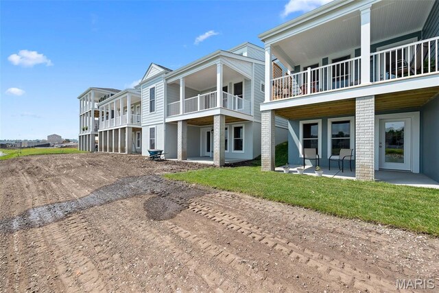114 Marais Temps Clair, Saint Charles, MO 63301 - back of house with driveway, a patio, and a balcony