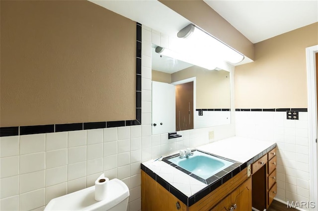 21 Mcfarland Dr, Rolla, MO 65401 - half bath featuring tile walls and vanity
