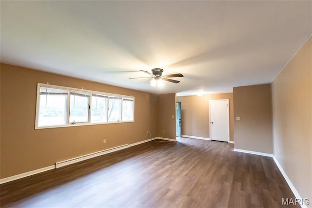 21 Mcfarland Dr, Rolla, MO 65401 - unfurnished room featuring baseboard heating, ceiling fan, and dark wood-style floors