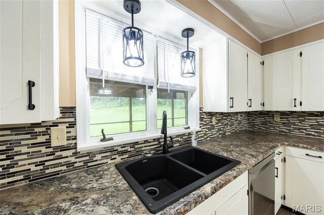 21 Mcfarland Dr, Rolla, MO 65401 - kitchen with stainless steel dishwasher, decorative backsplash, white cabinets, pendant lighting, and crown molding