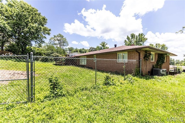 21 Mcfarland Dr, Rolla, MO 65401 - view of side of property with brick siding and a central air condition unit