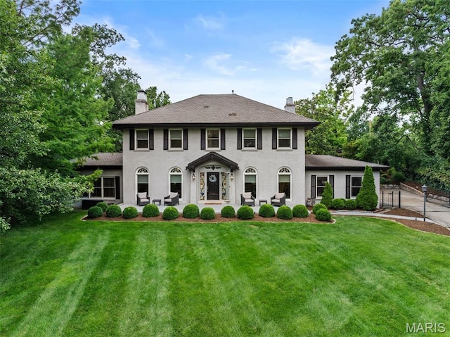 1259 Hampton Park Dr, Richmond Heights, MO 63117 - view of front of house featuring a chimney, a patio, and stucco siding