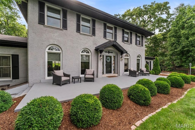 1259 Hampton Park Dr, Richmond Heights, MO 63117 - back of house featuring an outdoor hangout area and a patio area