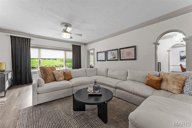 1259 Hampton Park Dr, Richmond Heights, MO 63117 - living room featuring ornamental molding, wood finished floors, a ceiling fan, arched walkways, and a textured ceiling