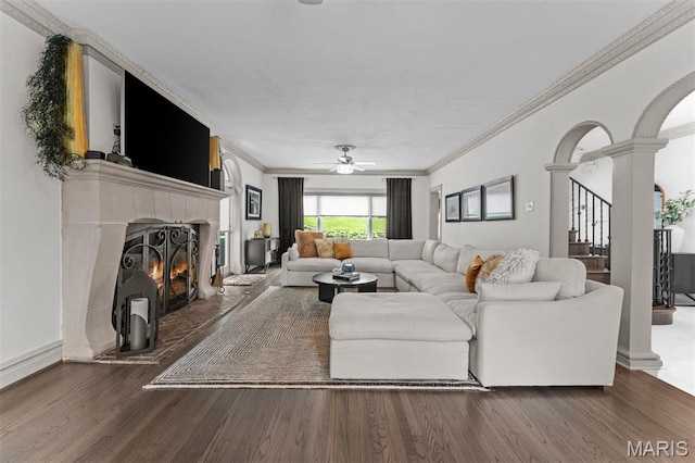 1259 Hampton Park Dr, Richmond Heights, MO 63117 - living area featuring decorative columns, ornamental molding, ceiling fan, wood finished floors, and a tile fireplace