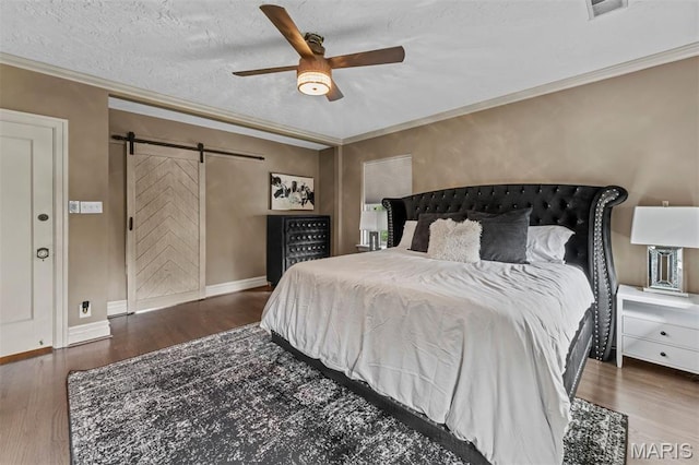 1259 Hampton Park Dr, Richmond Heights, MO 63117 - bedroom featuring a barn door, wood finished floors, ornamental molding, ceiling fan, and a textured ceiling
