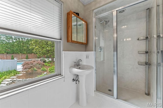 1259 Hampton Park Dr, Richmond Heights, MO 63117 - full bath featuring tile walls, a stall shower, tile patterned flooring, and a wainscoted wall