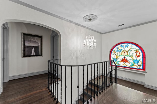 1259 Hampton Park Dr, Richmond Heights, MO 63117 - corridor with crown molding, wood finished floors, an upstairs landing, and a chandelier