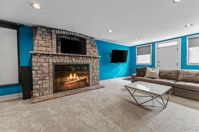 1259 Hampton Park Dr, Richmond Heights, MO 63117 - carpeted living room with a stone fireplace and recessed lighting