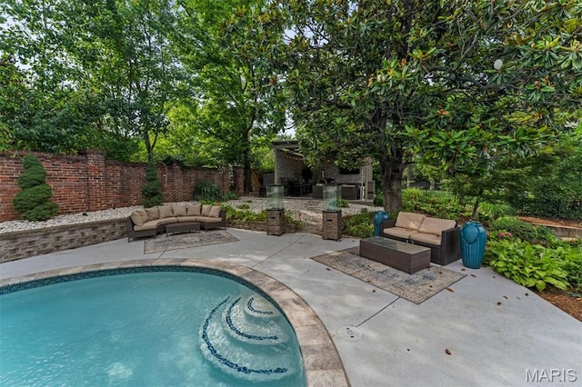 1259 Hampton Park Dr, Richmond Heights, MO 63117 - view of swimming pool with a patio, an outdoor hangout area, and a fenced backyard