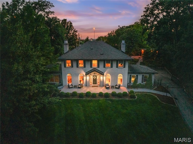 1259 Hampton Park Dr, Richmond Heights, MO 63117 - view of front facade with a chimney and a lawn