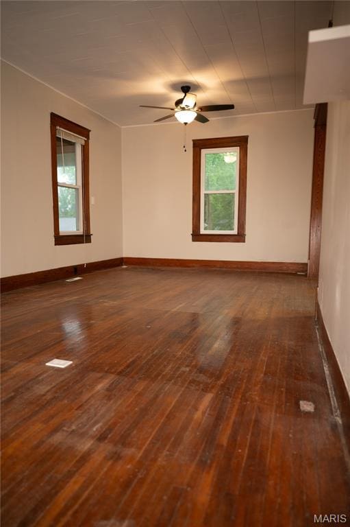 503 N Meramec St, St James, MO 65559 - unfurnished room with dark wood-style flooring, plenty of natural light, and ceiling fan