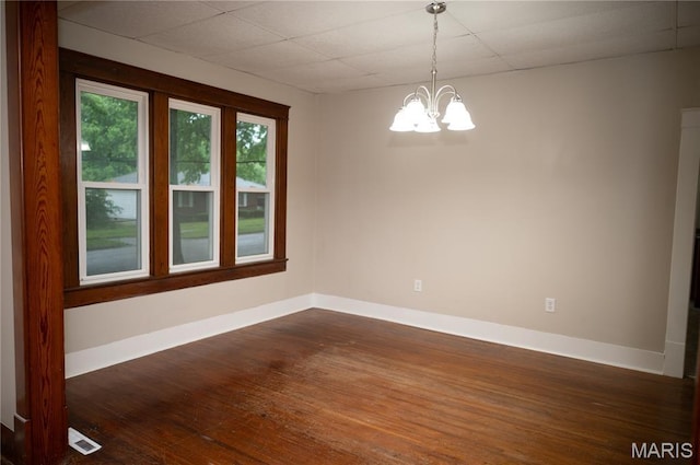 503 N Meramec St, St James, MO 65559 - spare room with a chandelier, dark wood-style floors, and a drop ceiling