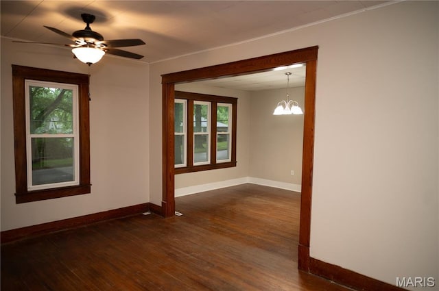 503 N Meramec St, St James, MO 65559 - spare room featuring plenty of natural light, dark wood-style floors, a ceiling fan, and a chandelier
