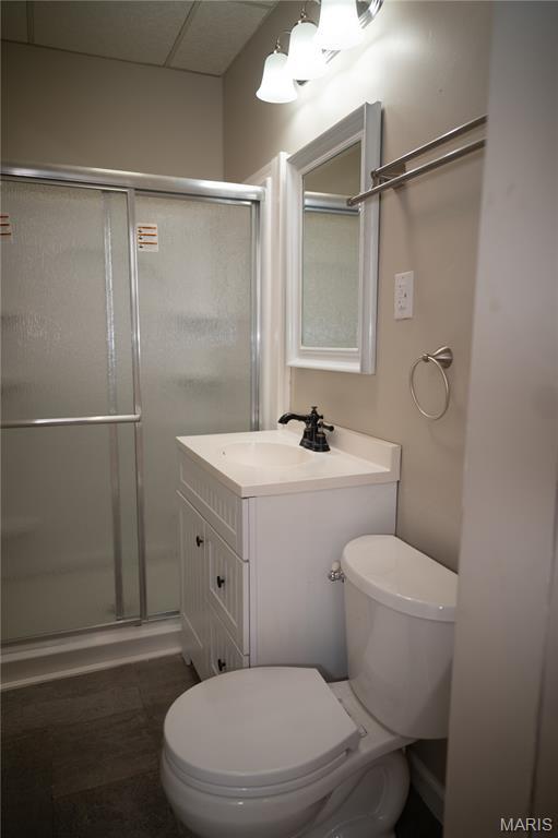 503 N Meramec St, St James, MO 65559 - full bathroom featuring a shower stall and vanity