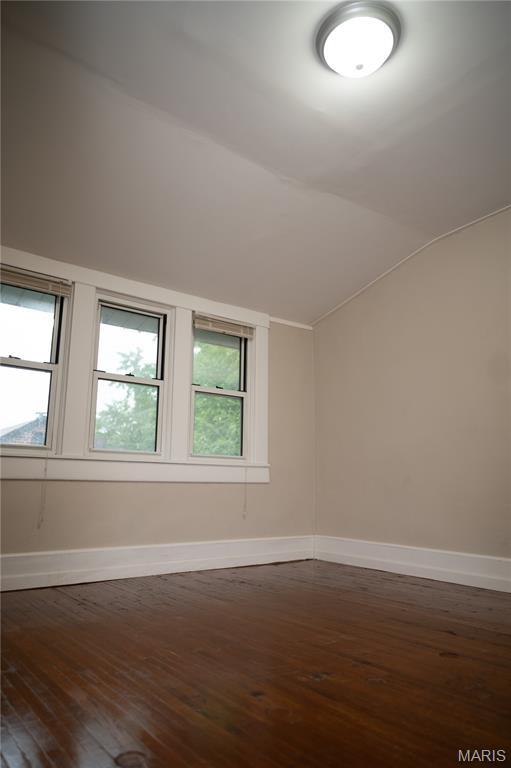 503 N Meramec St, St James, MO 65559 - empty room with hardwood / wood-style floors, vaulted ceiling, and plenty of natural light