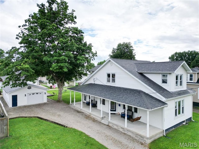 708 W Market St, Taylorville, IL 62568 - view of front of home featuring covered porch, a shingled roof, an outdoor structure, and a front yard