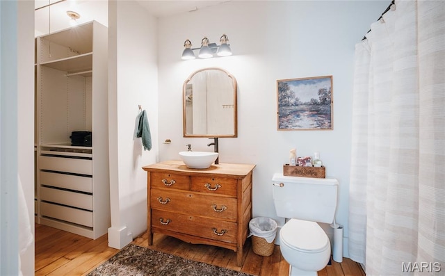 725 W Springfield St, St James, MO 65559 - full bath featuring wood finished floors and vanity