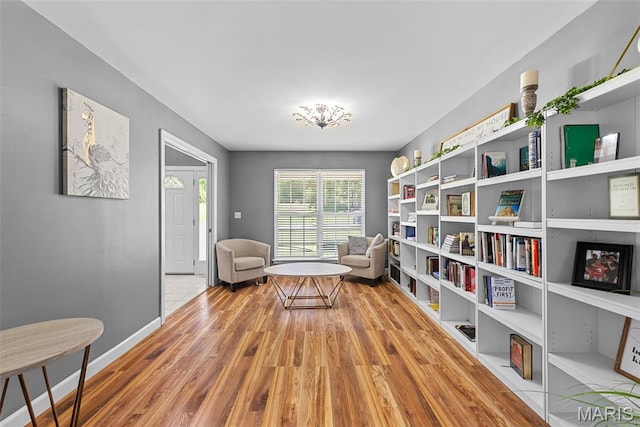 11264 Village Dr, Foristell, MO 63348 - sitting room with wood finished floors and baseboards