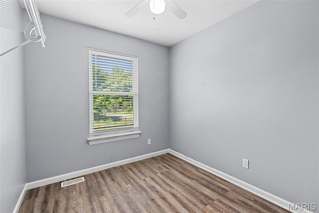 11264 Village Dr, Foristell, MO 63348 - empty room with wood finished floors and ceiling fan