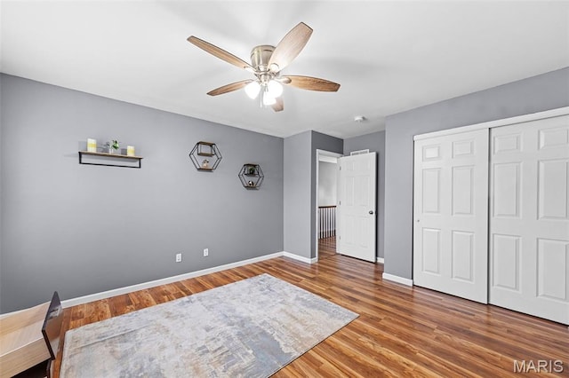 11264 Village Dr, Foristell, MO 63348 - bedroom featuring wood finished floors, a closet, and a ceiling fan